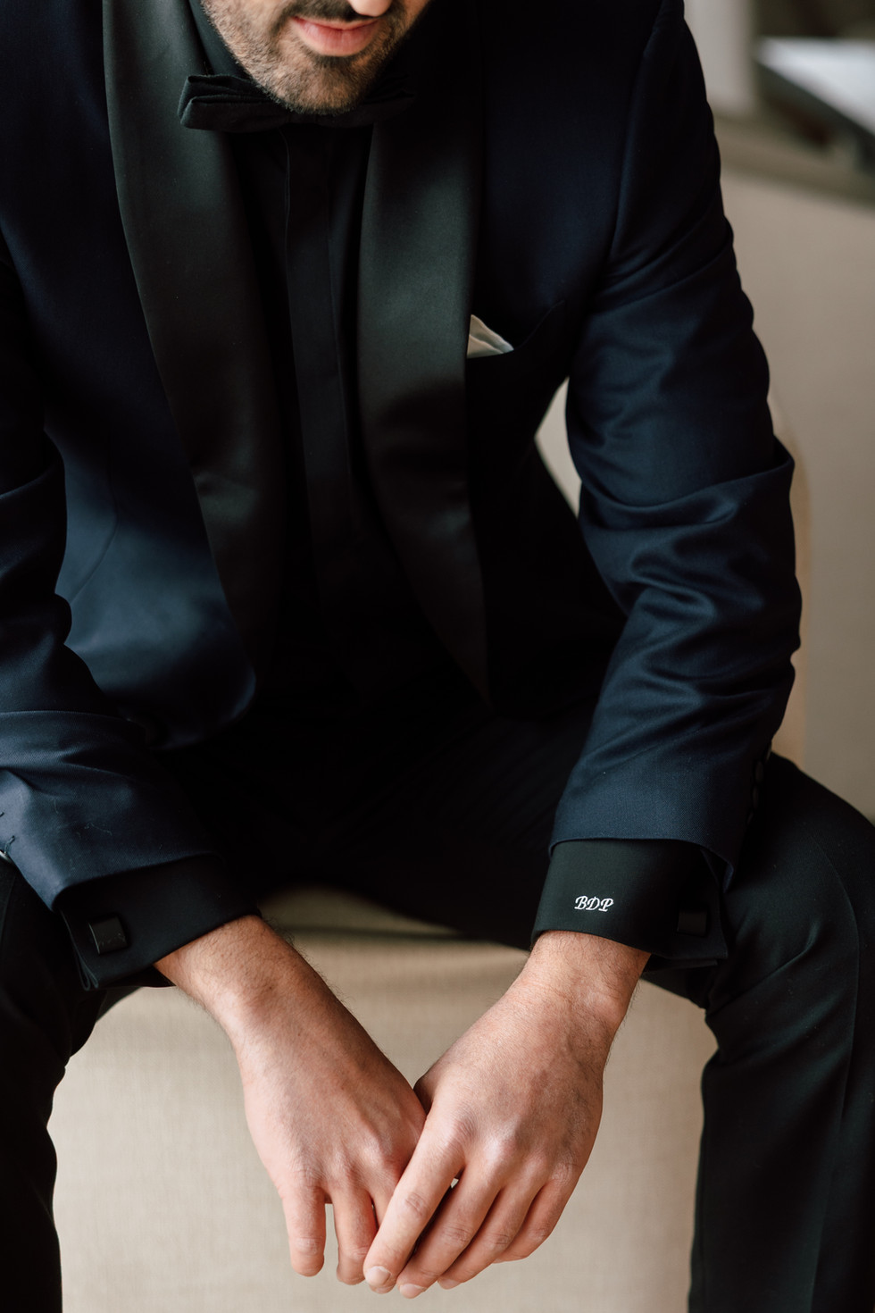 Groom getting ready on wedding day. 
