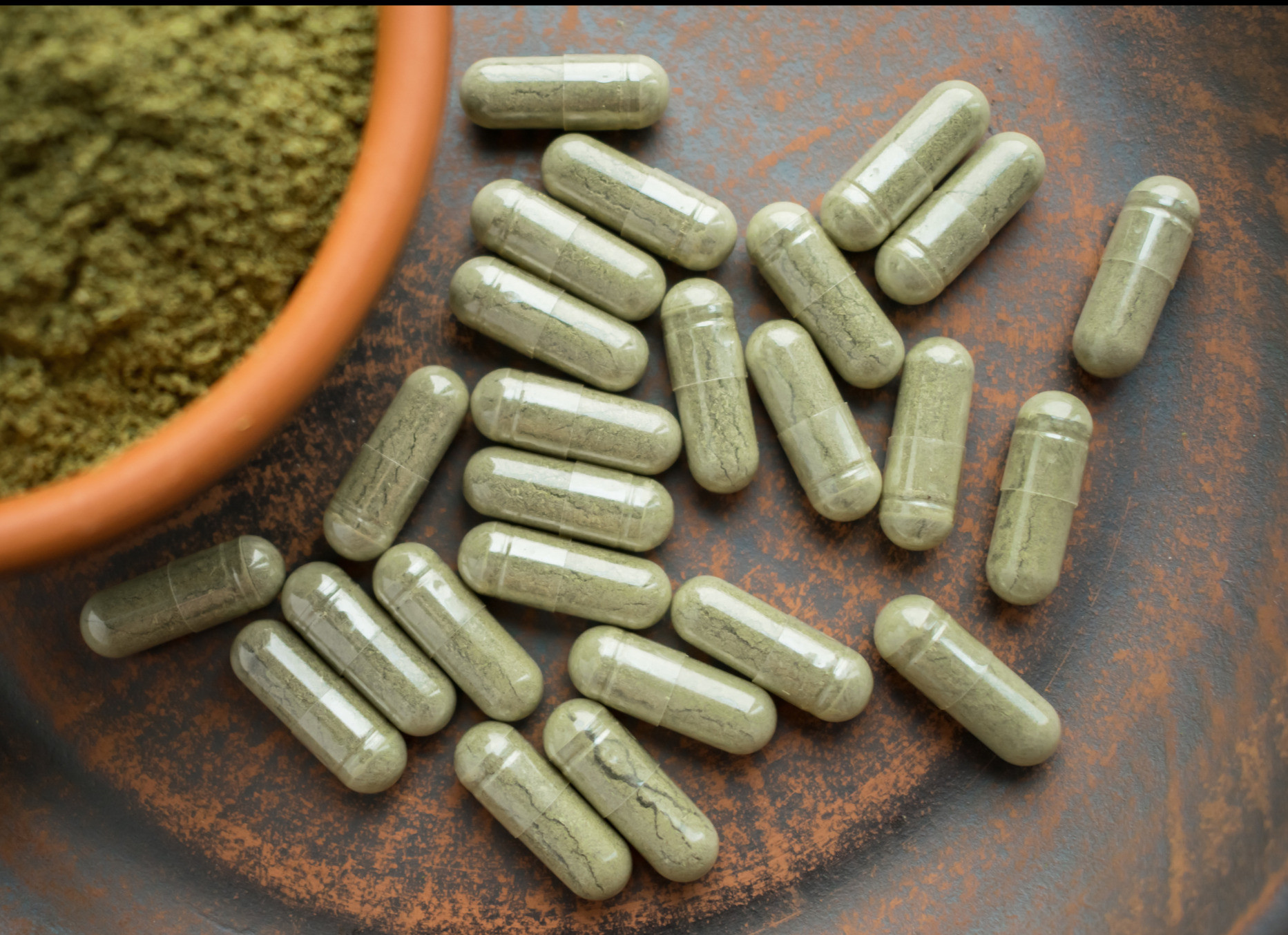 kratom capsules on the table
