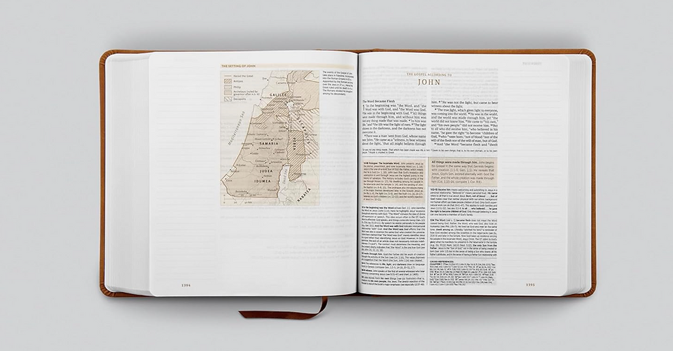 Open ESV Study Bible on a desk next to a coffee cup and keyboard, representing Bible study and devotional reading.