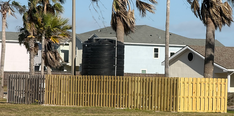 Fence surrounding the Don and Sandy Billish Park water tank on Padre Island prior to the community mural project