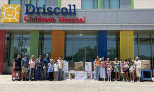 Community members, friends, and family gather at Driscoll Children's Hospital after donating toys through Kaylee's Light Foundation.