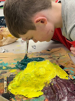 5th Grade Seashore Student, Thomas Reynold working on Mardi Gras Mas