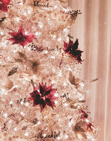 Soft Christmas tree lights at home, reflecting a peaceful holiday moment by Melissa Mitchell