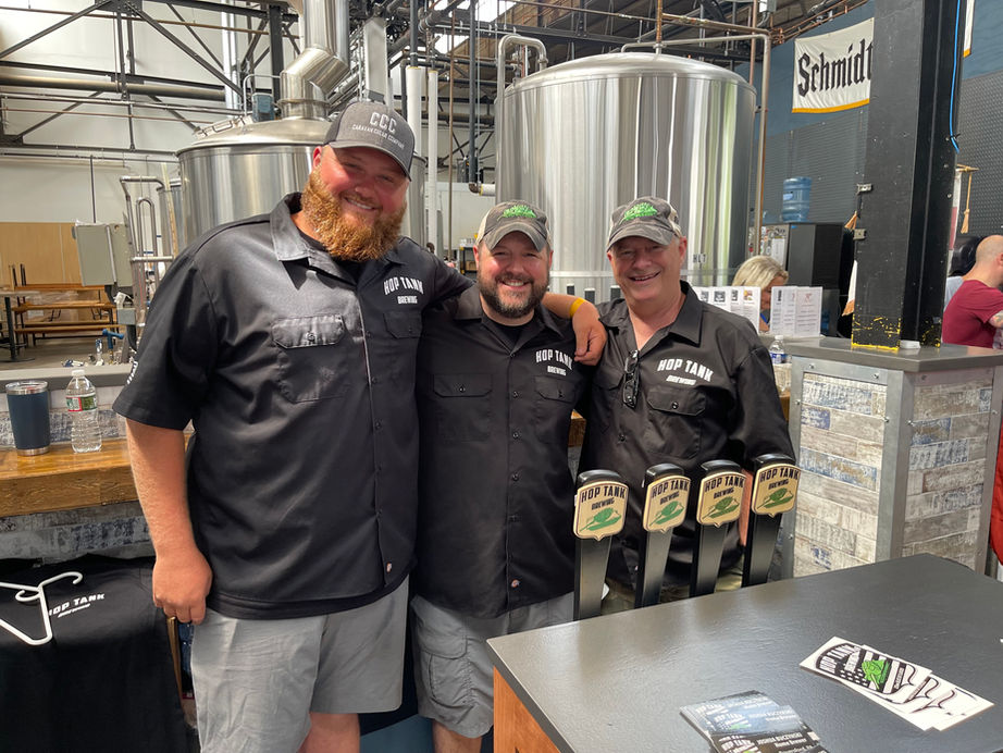 A picture of three members of Hop Tank Brew