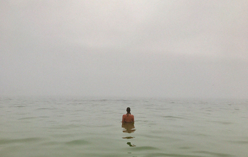 Back-of-Janine-standing-in-mistly-ocean.jpg