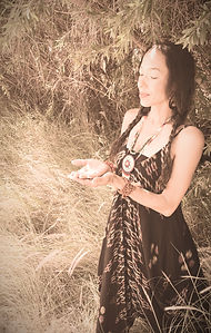 woman making offering in ceremony