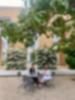 Two people sitting in the garden.