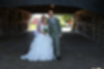 Jack and Alisha smiling together on their wedding day