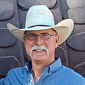 Robert Mitchell leatherworker wearing a cowboy hat.