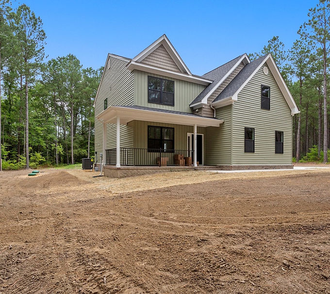 New two-story light green house