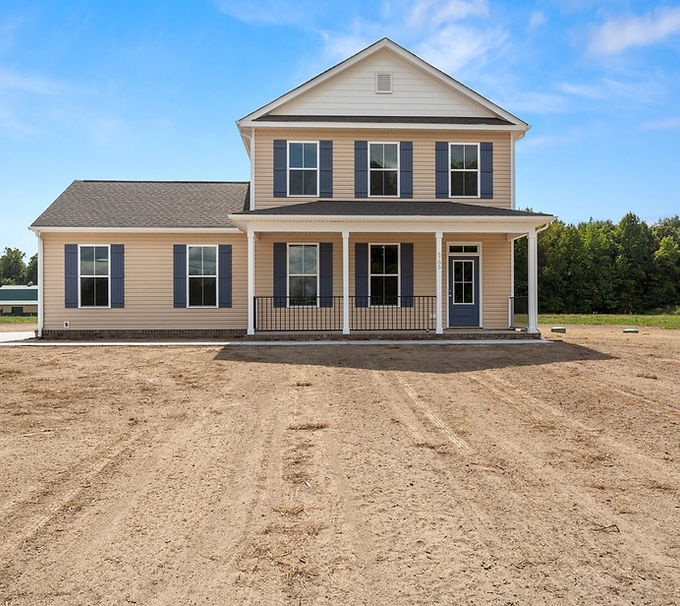 House that is Pelaiah Model, Tan two story house, dark grey roofing, white accents and columns, blue doors and shutters, Right hand side load garage, front view