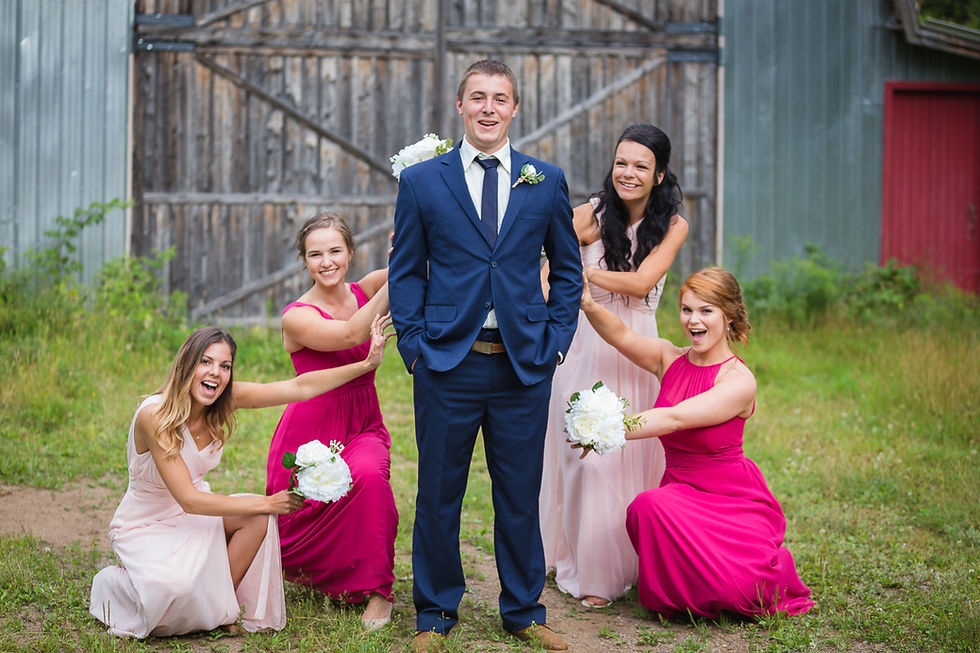 The groom is surrounded by beautiful bridesmaids