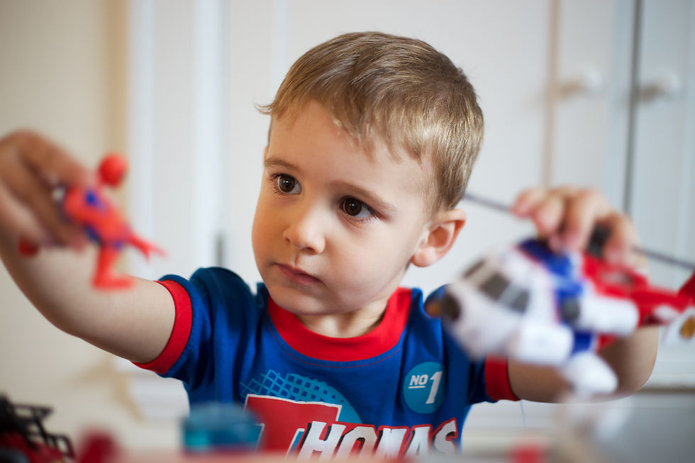A boy playing with toys