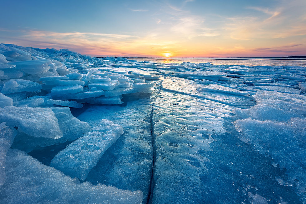 a crack in the ice leads the eye to the setting sun