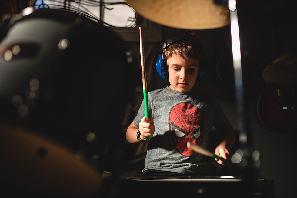 A boy playing drums