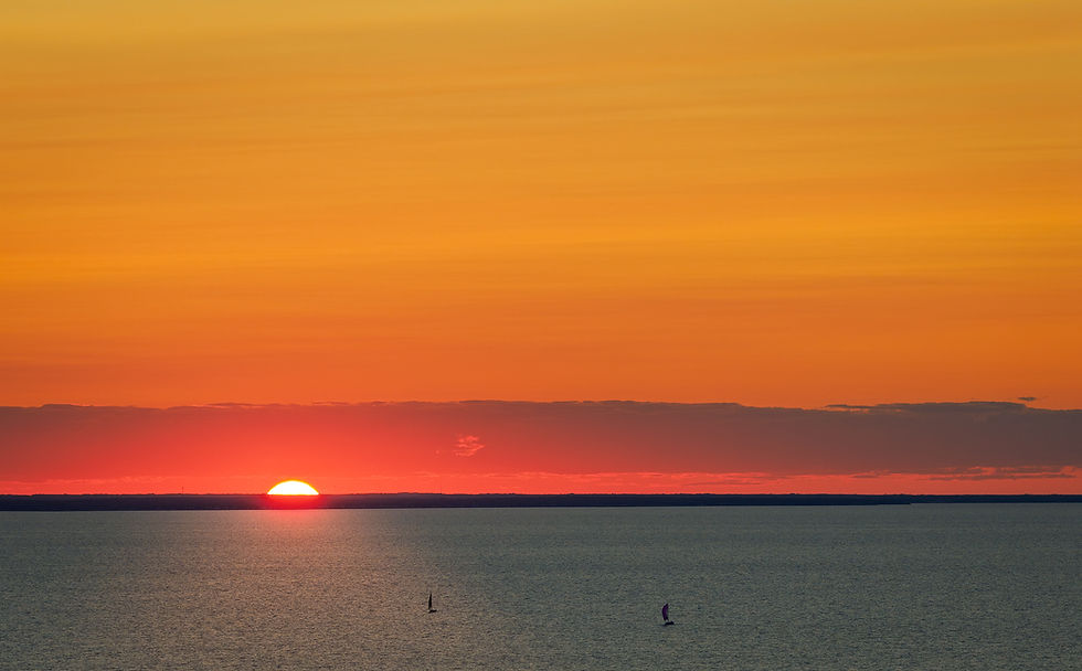 An orange sky at sunset over Shediac Bay in New Brunswick