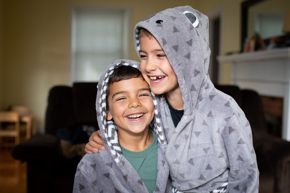 Brothers laughing and hugging