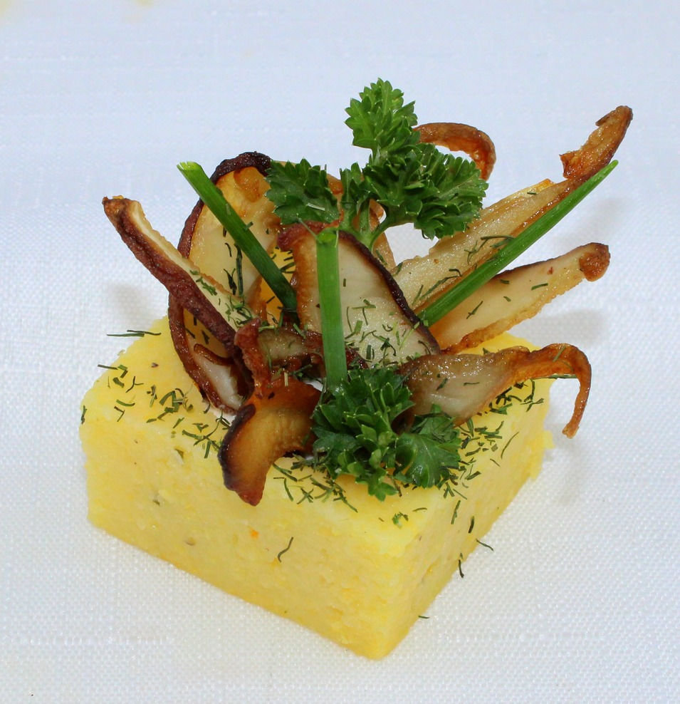 A bouchée of truffled polenta in a cube format prepared by Le Private Chef Sydney