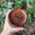 hand holding a cup a cacao