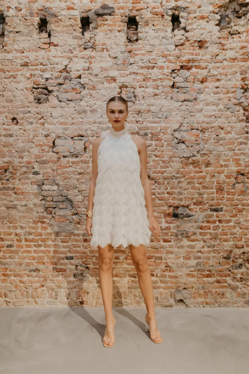 Thumbnail: Front of Bride in the Geminise Fringed Halter Neck Wedding Dress