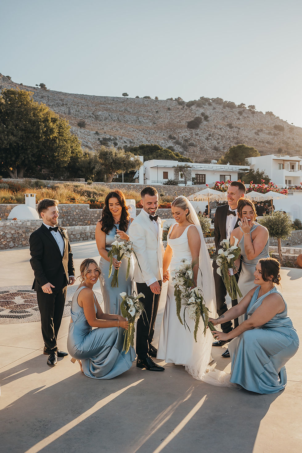 bridal party with rugged cliff backdrop