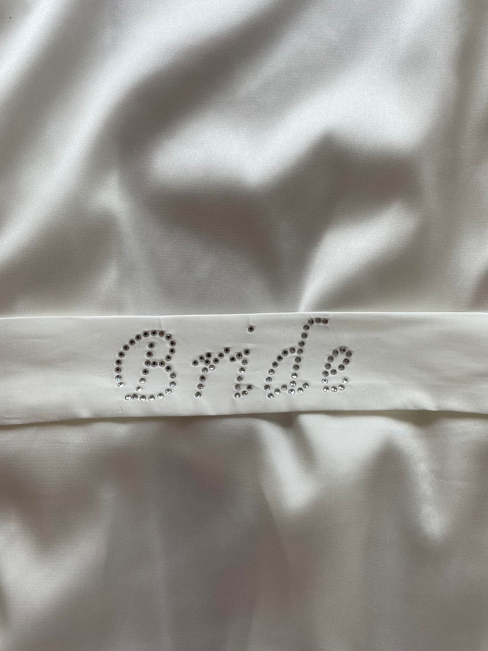Back of Bridal Satin Robe showing embroidered text 'Bride'
