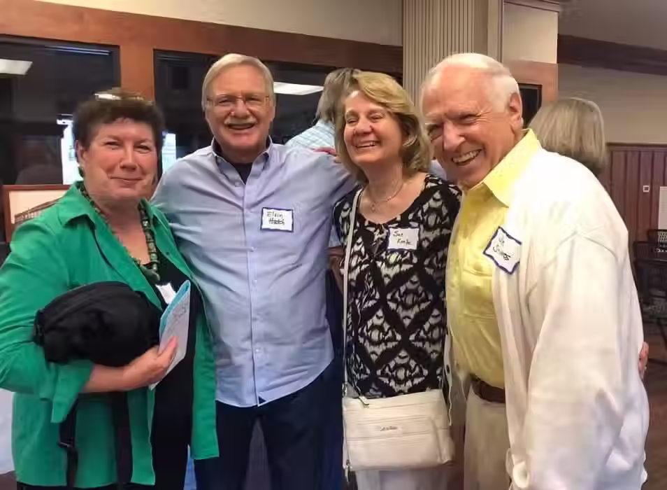 Two couples were happy during the meeting