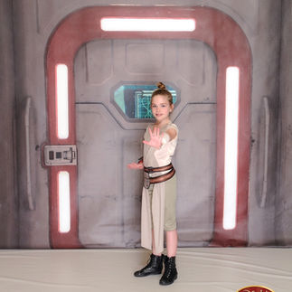 Girl posing as Rey on Disney Cruise Line Star Wars Day at Sea