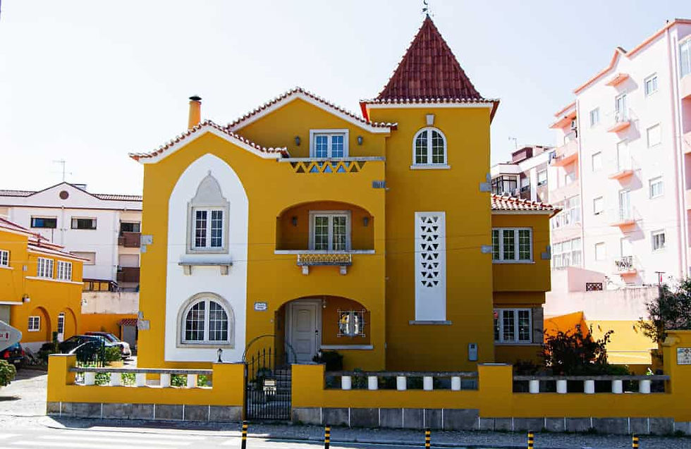 Bright yellow traditional house in Caldas da Rainha, Portugal.