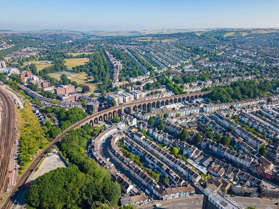 Aerial view of Brighton showing residential streets, green spaces and the railway viaduct.
