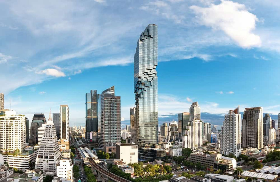 Modern Bangkok skyline with high-rise buildings and clear skies.