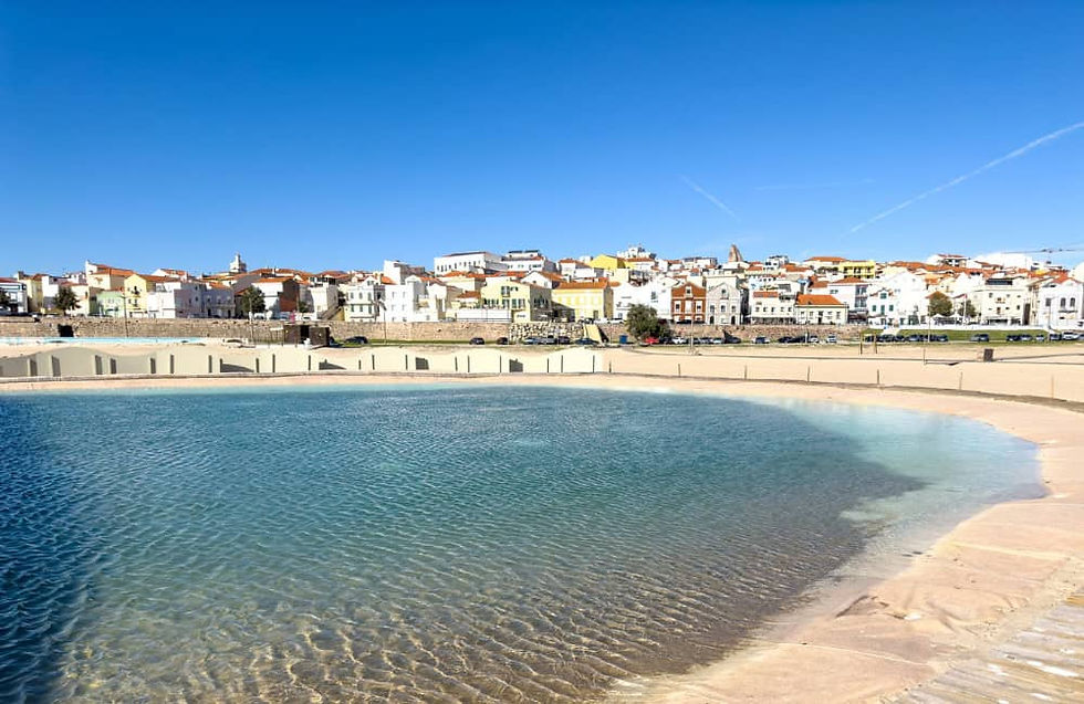 Praia da Claridade beach in Figueira da Foz with calm blue waters.