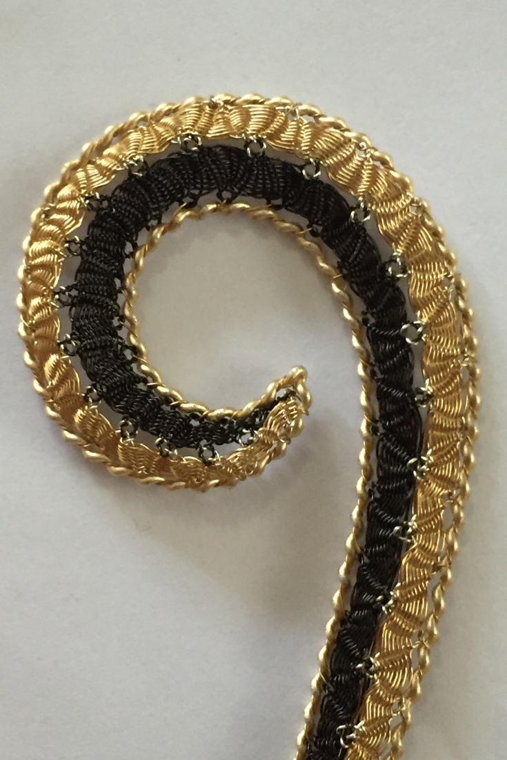 Wire bobbin lace curl by Lauran Sundin