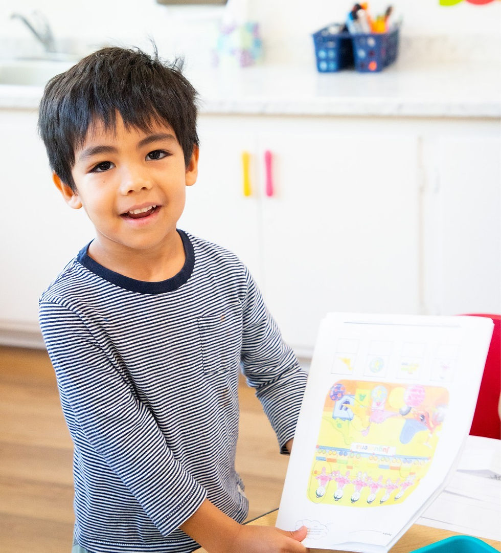 boy drawing at pre k class