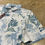 Thumbnail: Travis Mathew Featherweight Island Polo SIZE M White Blue Print 00142-MP-PO-B2