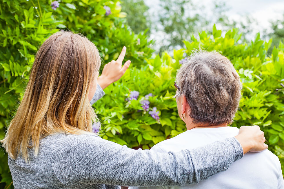 Resident sharing a warm moment with a family member at Manor Court residential aged care in Werribee.