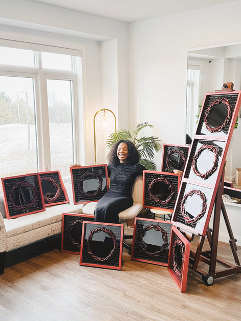 Bernice U. sitting with the Mini Crowns collection 
