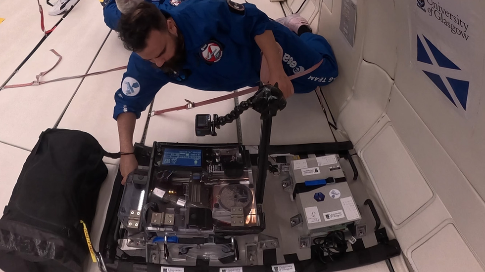 Researchers working on zero gravity 3d printing in a test plane.