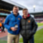 father next to his 21 year old son at a football ground non league football.jpg