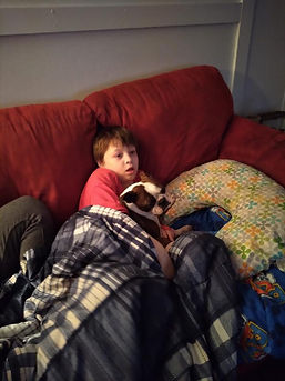 Lola emotional support dog with DJ Non verbal.jpeg