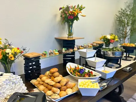 Buffet with a variety of dishes at an event, catered by Masterpiece Cuisine.