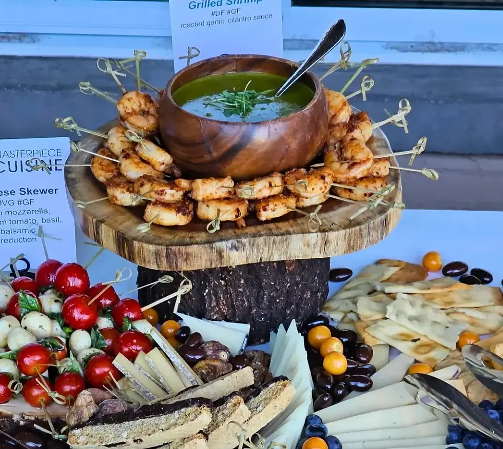 Masterpiece Cuisine upscale grazing station with grilled shrimp and cheeses for corporate events.
