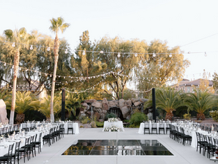 A decorated outdoor wedding venue, catered by Masterpiece Cuisine.