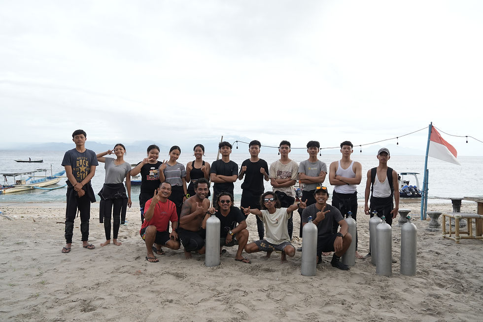 Participants and volunteers gather on the shore, ready for an underwater adventure in Nusa Penida.