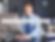 Man in blue shirt and tie working at a desk with a computer. Text overlay says "How to Scale Your Business with a Wedding Florist VA."