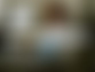 Woman with headset at desk, typing on a keyboard. Office setting with plants, monitors. Text: "Automate Admin With a Virtual Assistant for Transporter."