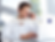 Man in white shirt smiling, on a phone call while using a laptop. Text overlay: "How to Onboard a VA in Under 30 Days." Bright office setting.