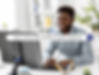 Smiling man at desk using a computer with text overlay: "How a Virtual Assistant for Real Estate Investors Simplifies Property Research."