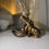 Thumbnail: Gold hippo storage sculpture shown in ambient lighting, highlighting texture and shape.