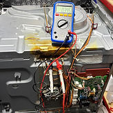 Oven Diagnostics image. Showing an oven being repaired. oven element, fan motor, cooling fan, thermostat * door hinge can be repaired here.